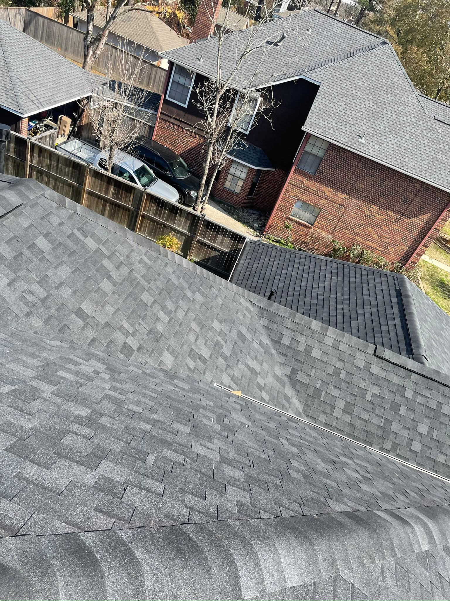 Freshly installed shingle roof in Houston by Carlos Affordable Roofing